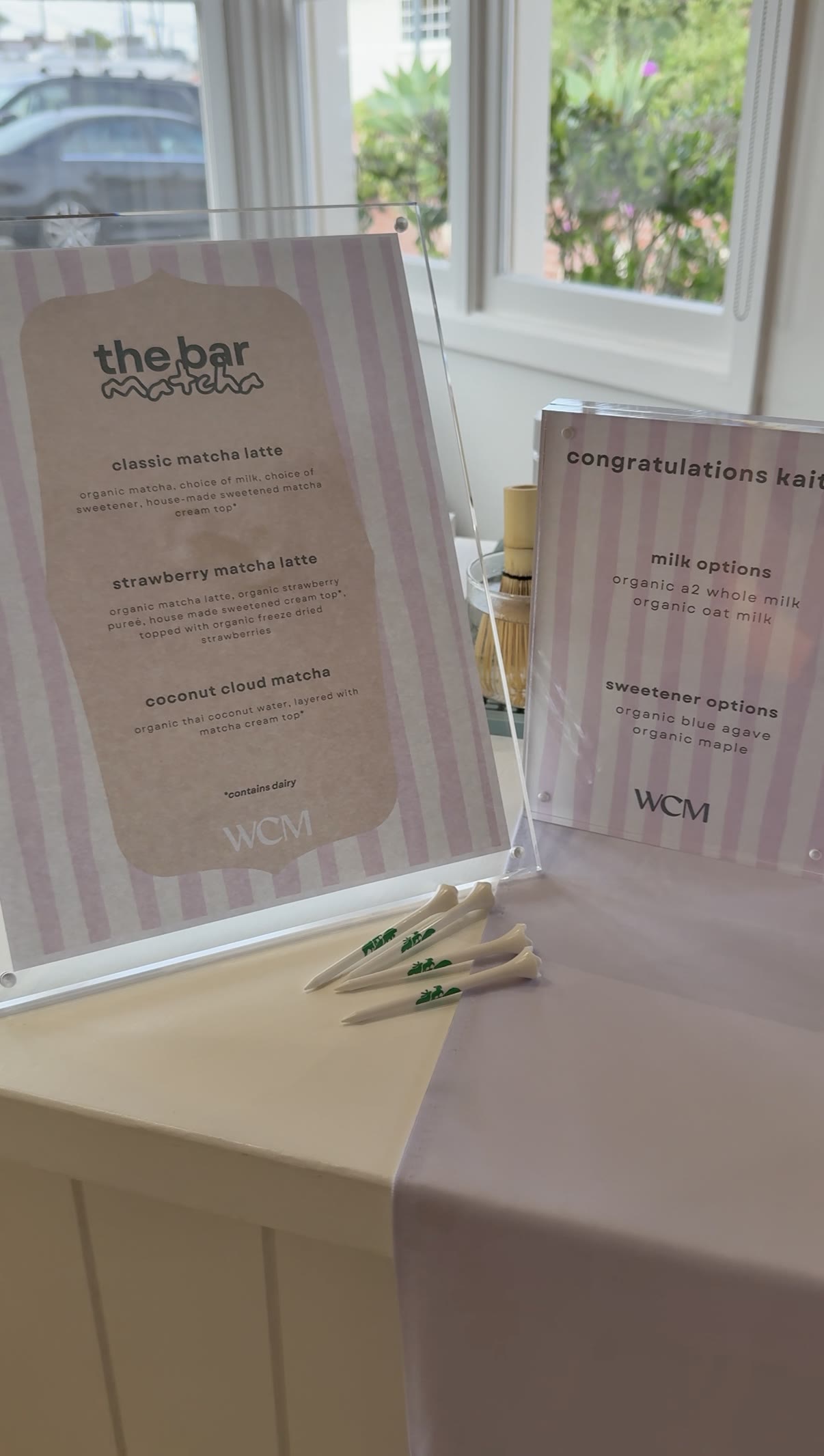 A custom branded matcha menu sign designed for a corporate client's event
