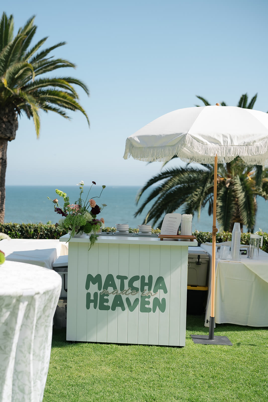 Branded matcha cart at an oceanfront wedding
