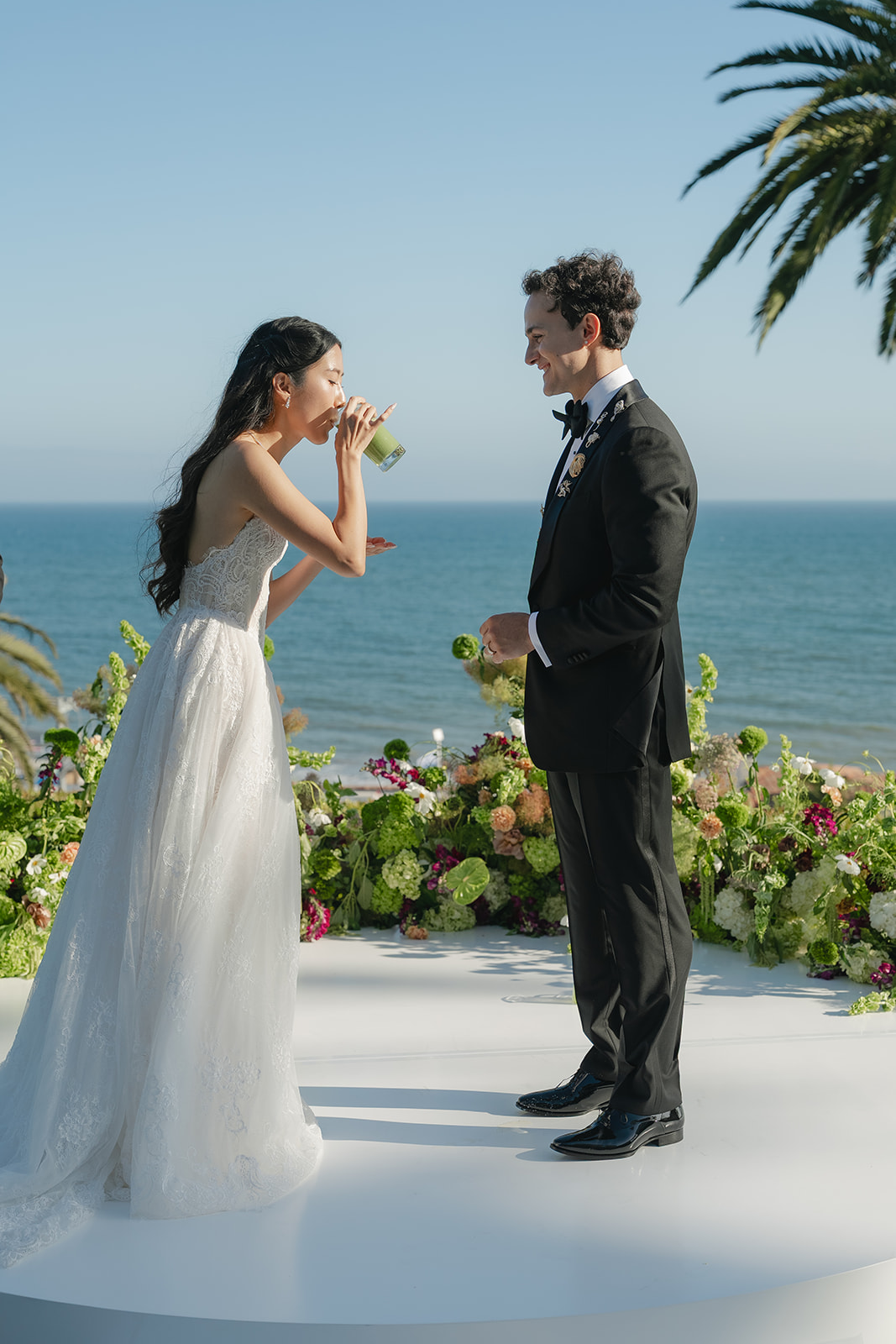Bride drinking matcha during a Bel-Air Bay Club wedding ceremony